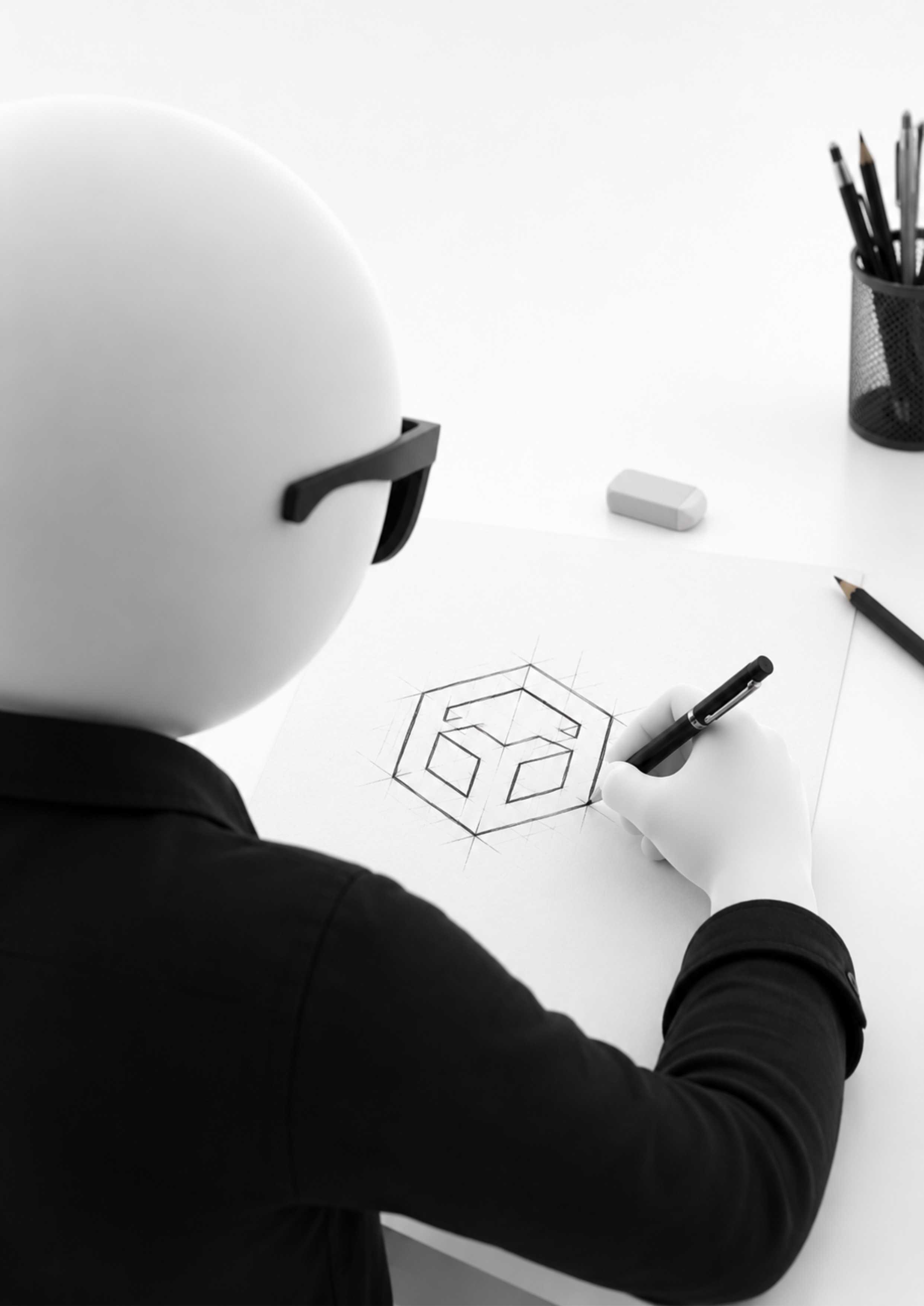 A Mr. Malayali designer sketching a logo mark on paper